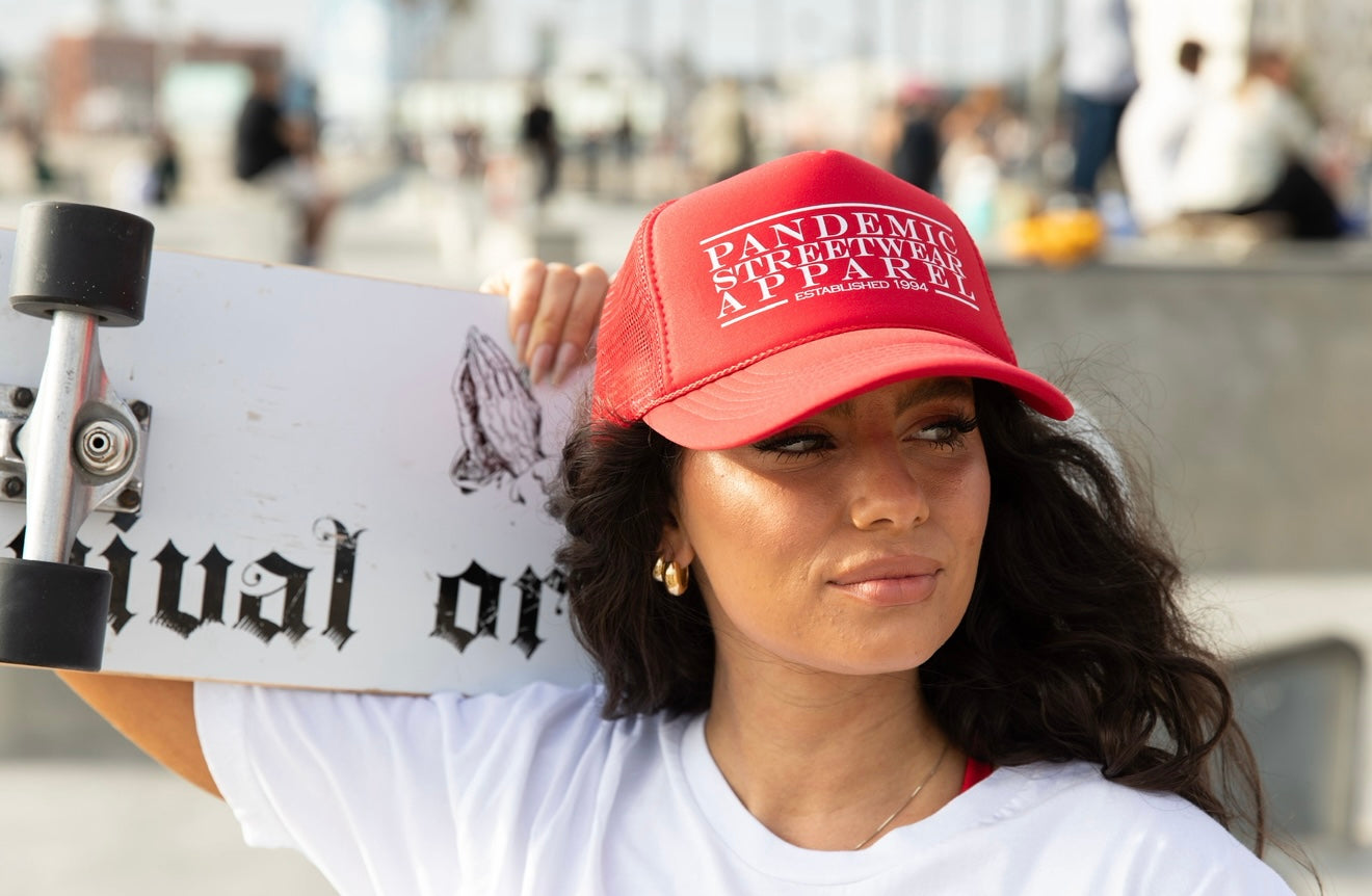A serene landscape featuring mountains, a lake, and a clear blue sky with fluffy clouds.